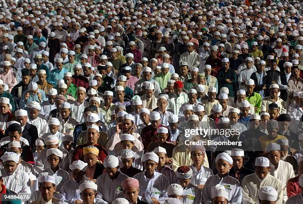 Muslims attend the pre-dawn prayers led by Nik Aziz Nik Mat, chief minister of Kelantan and spiritual leader of Malaysia's opposition Pan-Malaysian...