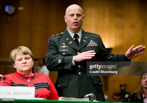 Retired Lt. Col. Diane E. Beaver, former staff judge advocate, Joint Task Force 170/JTF Guantanamo Bay, listens as her legal council James Friend...