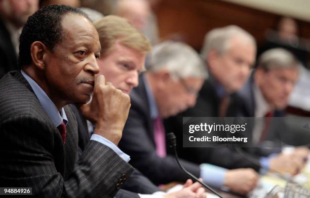 Gene Upshaw, executive director of the National Football League Players Association, left, listens during a hearing before the House Commerce, Trade...