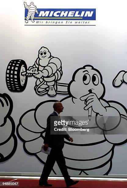 Visitor passes signage with the Michelin Man at the IAA Frankfurt Car Show in Frankfurt, Germany, Wednesday, September 14, 2005.