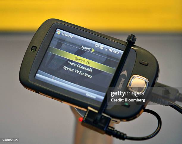 The Touch by HTC sits on display inside a Sprint store in New York, U.S., on Thursday, Feb. 28, 2008. Sprint Nextel Corp. Rose as much as 8.4 percent...