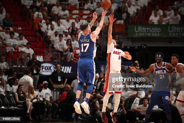 Tyler Johnson of the Miami Heat plays defense against JJ Redick of the Philadelphia 76ers in Game Three of Round One of the 2018 NBA Playoffs on...