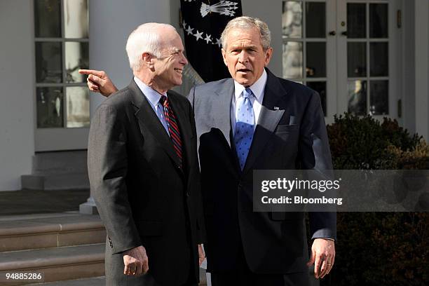 John McCain, U.S. Senator from Arizona and 2008 Republican presidential candidate, left, listens to U.S. President George W. Bush during a news...