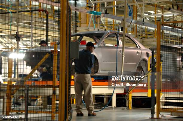 An assembly line worker works on a Hyundai Sonata sedan inside Hyundai's first U.S. Plant in Montgomery, Alabama Friday, May 20, 2005. Hyundai Motor...