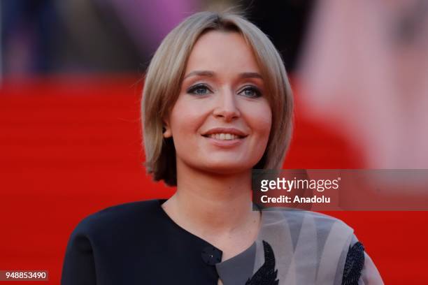 Actress Polya Polyakova poses on the red carpet during the opening ceremony of the 40th Moscow International Film Festival at the Rossiya Theatre in...