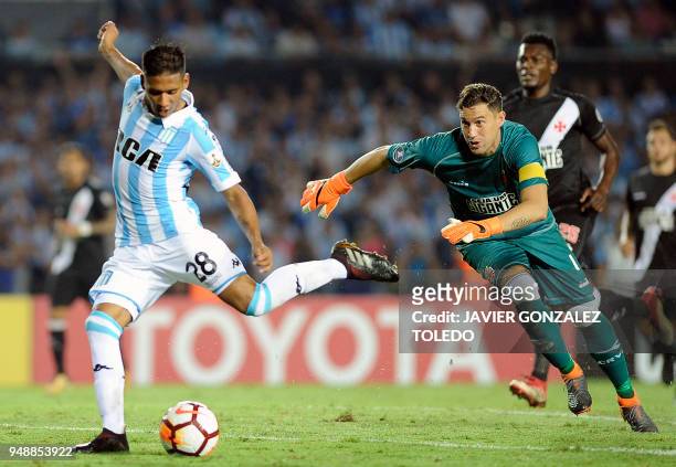 Brazil's Vasco da Gama Uruguayan goalkeeper Martin Silva fails to stop Argentina's Racing Club midfielder Matias Zaracho who controls the ball and...