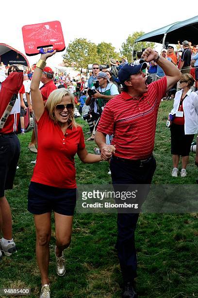 Phil Mickelson of the U.S. Team, right, and his wife Amy react after the U.S. Team's victory on day three of the 37th Ryder Cup at Valhalla Golf Club...