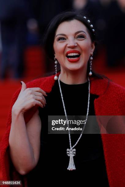 Designer Alisa Tolkacheva poses on the red carpet during the opening ceremony of the 40th Moscow International Film Festival at the Rossiya Theatre...