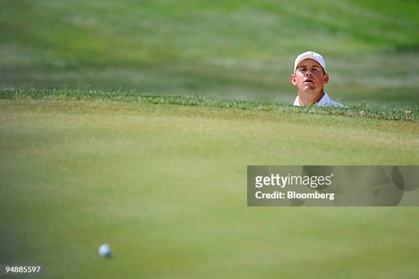 Lee Westwood of the European team watches his ball go onto the green during a singles match against Ben Curtis of the U.S. Team on day three of the...