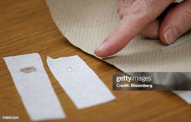 Glenn Evers, a former DuPont Co. Employee, demonstrates in the offices of the Environmental Working Group, a Washington-based watchdog group, in...