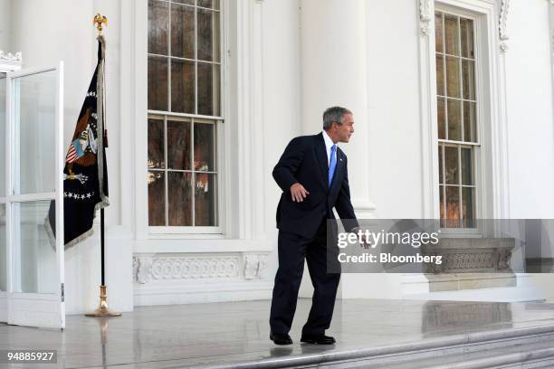 President George W. Bush does a few dance steps on the North Portico of the White House while joking around with the press corps in Washington, D.C.,...
