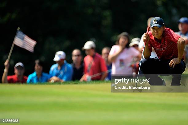 Anthony Kim of the U.S. Team lines up a birdie putt on the 2nd hole during a singles match against Sergio Garcia of the European team on day three of...