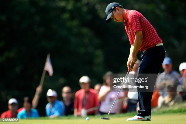 Anthony Kim of the U.S. Team sinks a birdie putt on the 2nd hole during a singles match against Sergio Garcia of the European team on day three of...