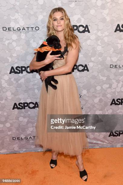 Model Nina Agdal poses with a puppy during the 21st Annual Bergh Ball hosted by the ASPCA at The Plaza Hotel on April 19, 2018 in New York City.