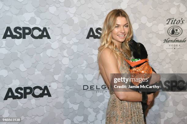 Model Jessica Hart poses with a puppy during the 21st Annual Bergh Ball hosted by the ASPCA at The Plaza Hotel on April 19, 2018 in New York City.