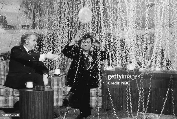 Pictured: Announcer Ed McMahon and actor Robert Blake during an interview with host Johnny Carson on December 31, 1976 --