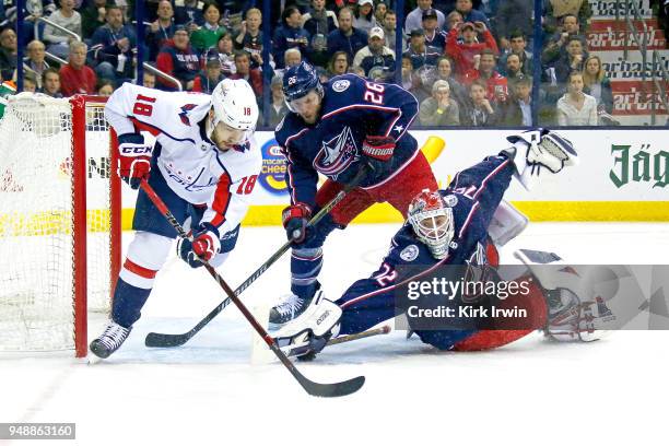 Sergei Bobrovsky of the Columbus Blue Jackets dives to block a shot from Chandler Stephenson of the Washington Capitals during the first period in...