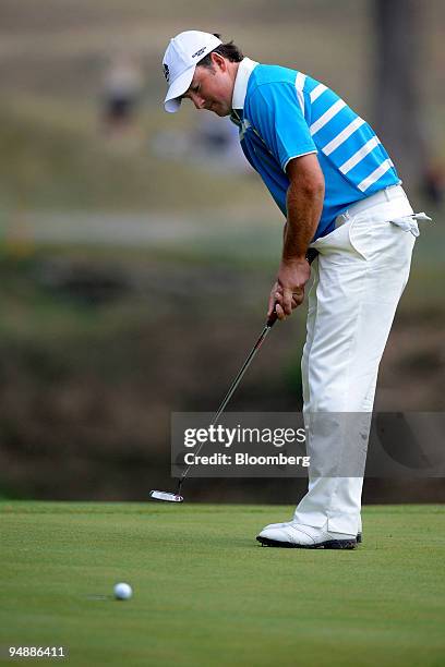 Golfer Graeme McDowell of the European team reacts after just missing a 12-foot putt on the 6th hole during a morning foursome match on day two of...