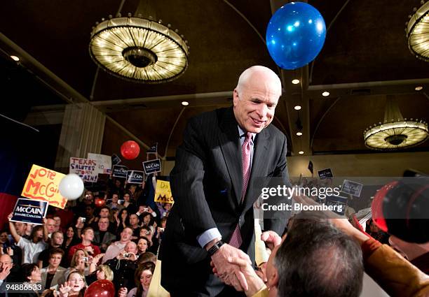 John McCain, U.S. Senator from Arizona and 2008 Republican presidential candidate, shakes supporters' hands at a primary night event in Dallas,...