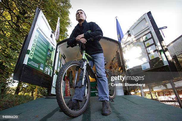 Simon Scoble, who runs a franchise business 'Country Lanes' cycle center from a converted railway carriage in Brockenhurst, Hampshire, England poses...