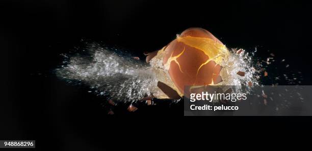 egg explosion - bullet speeding stock pictures, royalty-free photos & images
