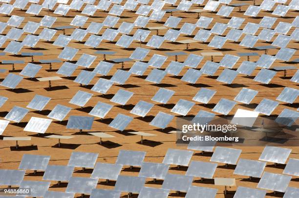 Rows of heliostats stand in the sun at the solar plant owned by BrightSource Energy Inc., in the Negev Desert, in Israel, on Thursday, June 12, 2008....