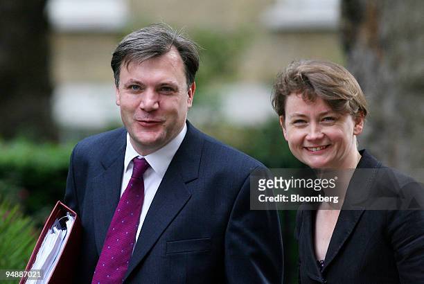 Ed Balls, U.K. Education secretary, left, and his wife Yvette Cooper, chief secretary to the Treasury, arrive for the weekly cabinet meeting at...