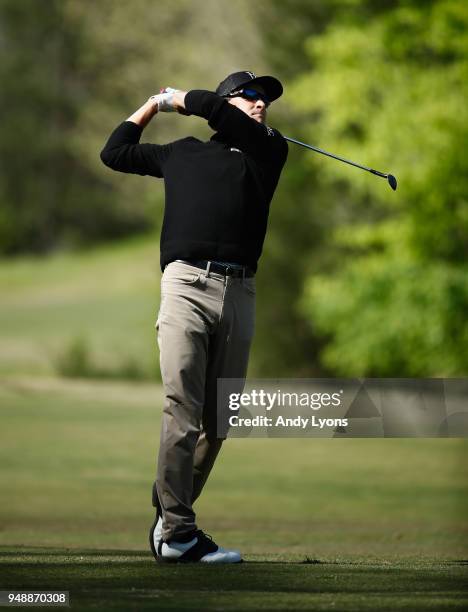 Scott Langley hits his second shot on the 13th hole during the first round of the North Mississippi Classic at the Country Club of Oxford on April...