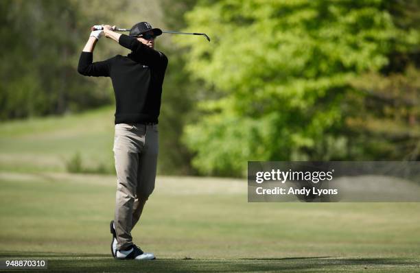 Scott Langley hits his second shot on the 13th hole during the first round of the North Mississippi Classic at the Country Club of Oxford on April...