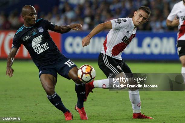 Rafael Santos Borré of River Plate fights for the ball with Oscar Bagui of Emelec during a match between Emelec and River Plate as part of Copa...