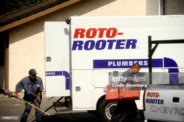 Roto-Rooter employees unload a van at the end of their shift on Friday, May 30, in Concord, Calif.