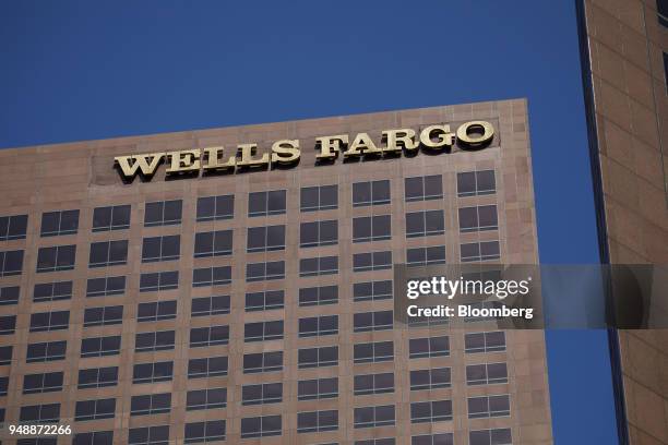 Wells Fargo & Co. Signage is displayed on the Wells Fargo Center skyscraper in Los Angeles, California, U.S., on Thursday, April 19, 2018. Wells...