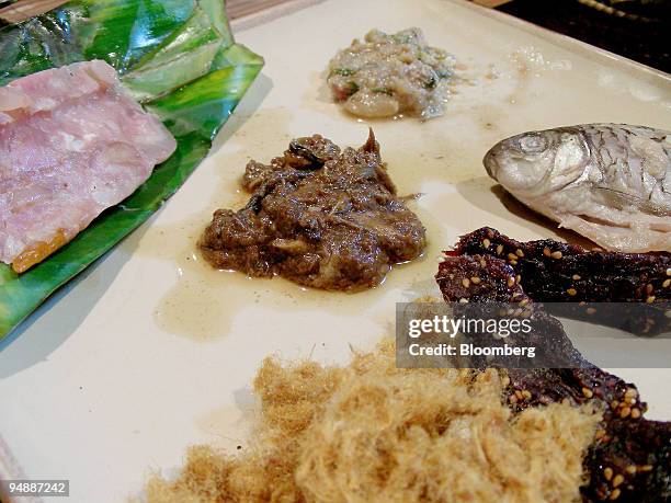 The second course of the "Adventurous Gourmet Experience" is arranged for a photograph at Tamarind restaurant in Luang Prabang, Laos, on Thursday,...