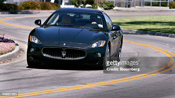 The 2009 Maserati GranTurismo is driven around a curve in Dana Point, California, U.S., on Friday, June 6, 2008. The car is powered by a 4.2-liter...