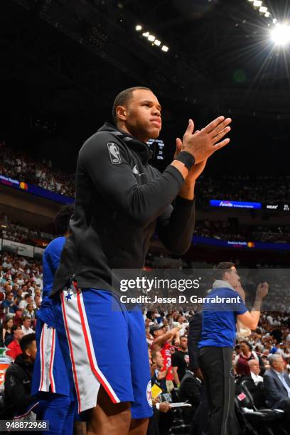 Justin Anderson of the Philadelphia 76ers celebrates from the bench against the Miami Heat in Game Three of Round One of the 2018 NBA Playoffs on...