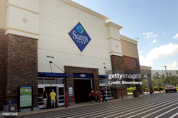 Shoppers exit a Sam's Club store in Fayetteville, Arkansas, U.S., on Thursday, June 5, 2008. Wal-Mart Stores Inc.'s gains in May were fueled by a 6.5...