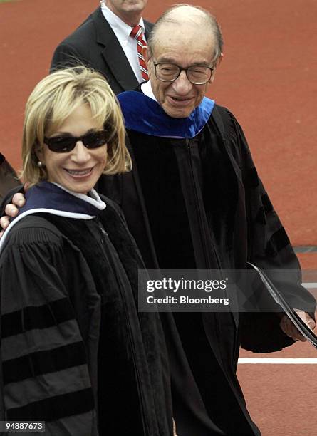 Alan Greenspan, Chairman, Board of Governors, Federal Reserve System, and his wife Andrea Mitchell, join the commencement processional at the...