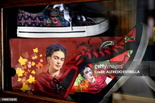 Shoes with the image of late Mexican artist Frida Kahlo, are exhibited -alongside other commercial products- at her sister's house in the...