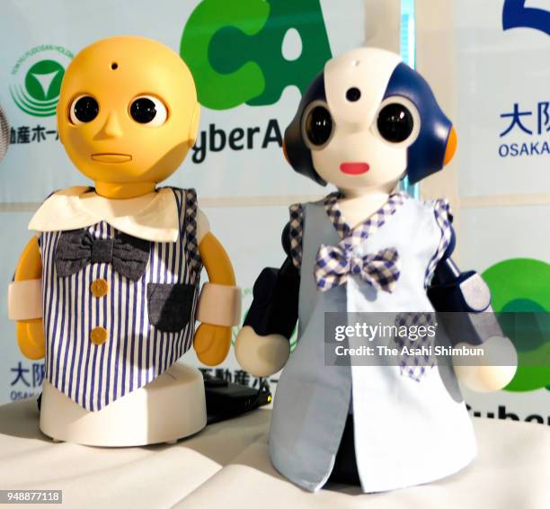 Robot concierge 'CommU' and 'Sota' are displayed during a press conference on April 18, 2018 in Tokyo, Japan.