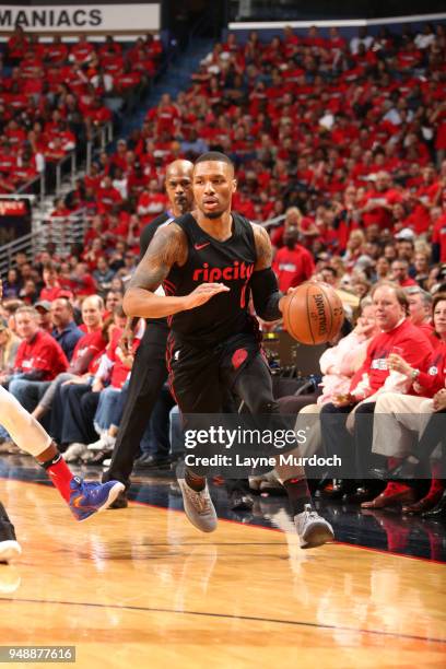 Damian Lillard of the Portland Trail Blazers handles the ball against the New Orleans Pelicans in Game Three of Round One of the 2018 NBA Playoffs on...