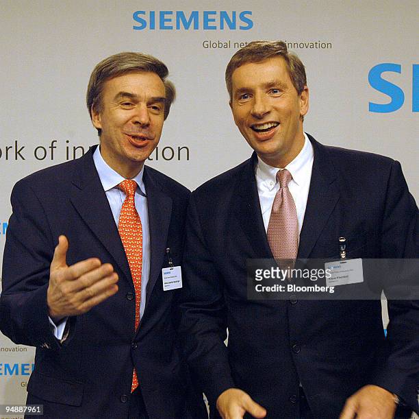 Siemens Chief Financial Officer Heinz-Joachim Neubuerger, left, and Siemens Chief Executive Klaus Kleinfeld speak prior a press conference in Munich,...