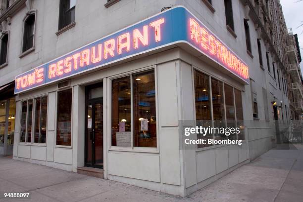 Neon sign marks the exterior of Tom's Restaurant located on the corner of Broadway and 112th St in New York, U.S., on Friday, Feb. 29, 2008. Tom's...