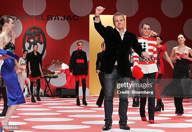 Jean-Charles de Castelbajac, fashion designer, waves to the audience after presenting his Fall/Winter 2008-2009 ready-to-wear collection in Paris,...