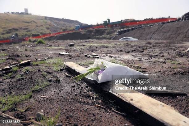 Flowers are offered at the Takanodai area which was hit by series of strong earthquakes on April 16, 2018 in Minamiaso, Kumamoto, Japan. The final...