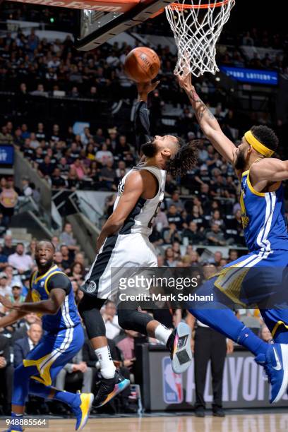 Patty Mills of the San Antonio Spurs goes to the basket against the Golden State Warriors during Game Three of the Western Conference Quarterfinals...