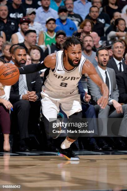 Patty Mills of the San Antonio Spurs handles the ball against the Golden State Warriors during Game Three of the Western Conference Quarterfinals in...