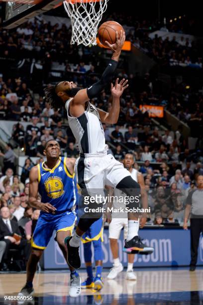 Patty Mills of the San Antonio Spurs goes to the basket against the Golden State Warriors during Game Three of the Western Conference Quarterfinals...