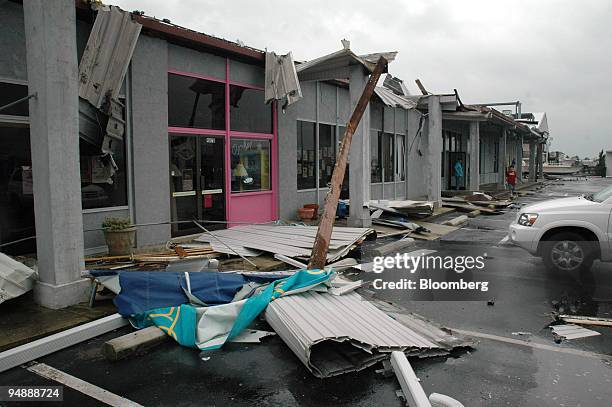 Debris lies on the walkway September 15 of an Atlantic Beach, North Carolina shopping center that lost its roof due to Hurricane Ophelia.