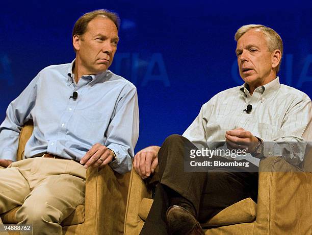 Daniel R. Hesse, president and chief executive officer of Sprint Nextel Corp., listens as Lowell C. McAdam, president and chief executive officer of...