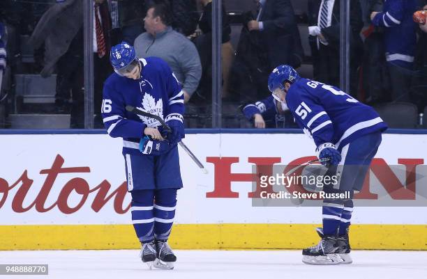 Dejected, Toronto Maple Leafs center Mitchell Marner and Toronto Maple Leafs defenseman Jake Gardiner skate off the ice as the Toronto Maple Leafs...